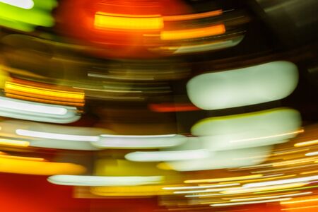 Colorful abstract defocused blurred light bokeh background, urban nightlife conceptの写真素材