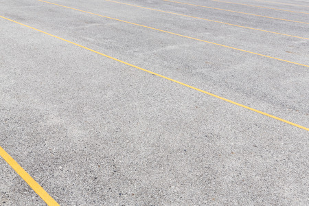 Concrete road texture with yellow color lines, outdoor parking lot, empty streetの写真素材