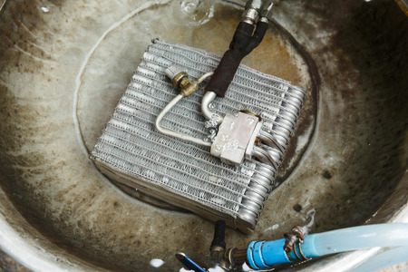 Car air conditioner condenser leaking check, under water leak detectionの写真素材