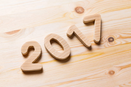 Year 2017 alphabet letter numeric number on old wooded background