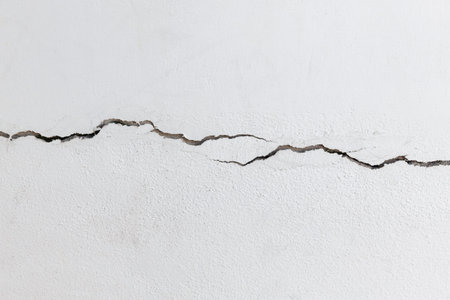 Close up cracked concrete wall, damaged structure of construction