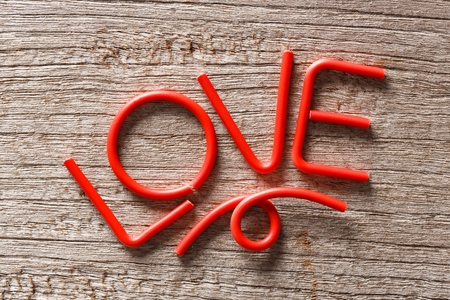 Love alphebet on wooden background, valentine conceptの写真素材