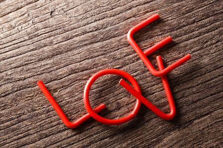 Love alphebet on wooden background, valentine conceptの写真素材
