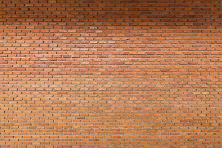Old and dirty red color brick wall background, seamless patternの写真素材