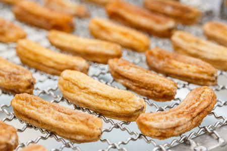 Close up sun dried organic bananas on stainless steel wire meshの写真素材