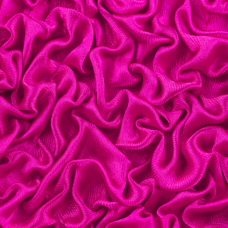 Close up purple magenta violet color cloth decoration in rippled style backgroundの写真素材