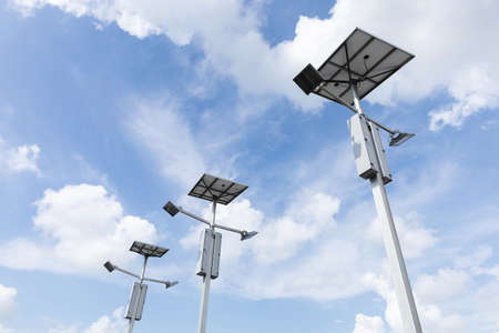 Outdoor solar cell LED flood light on blue skyの写真素材