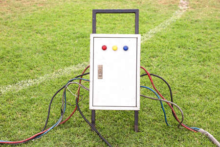 Old and dirty outdoor electrical power distribution box with circuit breaker and signal lights, industrial high voltage electricity safety equipmentの写真素材