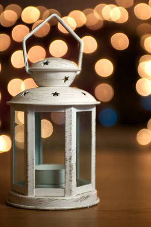 Rusted Christmas Lantern with Sparkly Fairy lights in the backgroundの写真素材