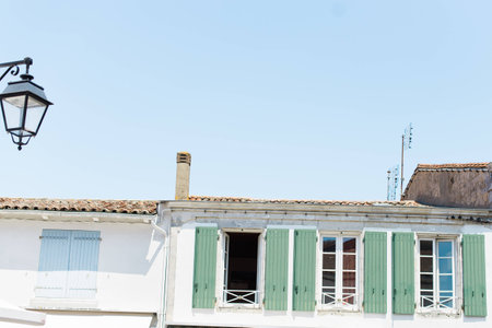 Open shuttered windows on a rural street in the south of Franceの写真素材