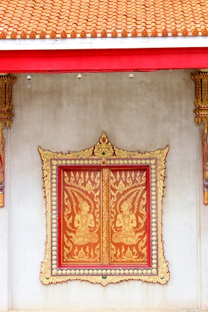 wooden window of Thai temple in Thailandの写真素材