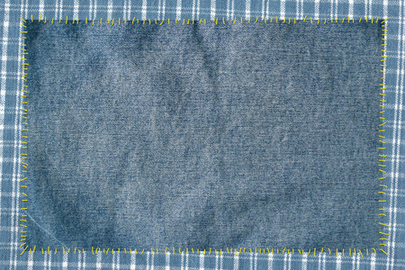 cloth attached by threads to jeans