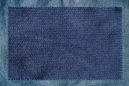cloth attached by threads to jeans