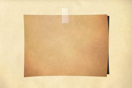 note paper taped on backgroundの写真素材