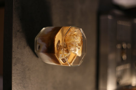 coffee, iced coffee, espresso, cold brew, coffee glass, coffee drink, cafe, barista, specialty coffee, coffee shop, minimal, dark background, bokeh, shallow depth of field, close uの写真素材