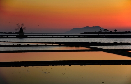 Old windmills on the salt pans in Sicilyの写真素材