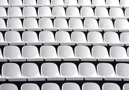 Gray plastic chairs at thetribune football stadiumの写真素材