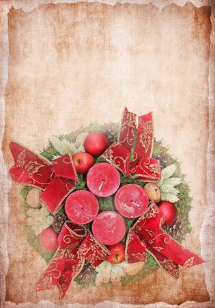 Advent wreath with red candles and applesの写真素材