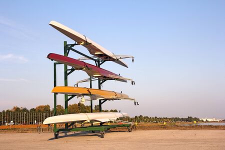 Four rowing boats standing on metal standの写真素材