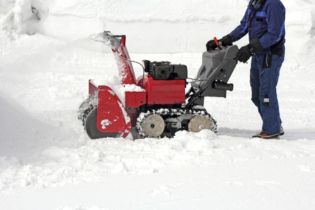 Work the removal snow with snow machinesの写真素材
