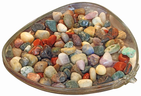 Colorful semi-precious stones in a glass bowlの写真素材
