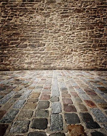 old stone walls and floors of stone cubes, to use as a backgroundの写真素材