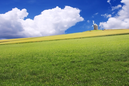 An old windmill on a hill above the grain, Normandy, Franceの写真素材