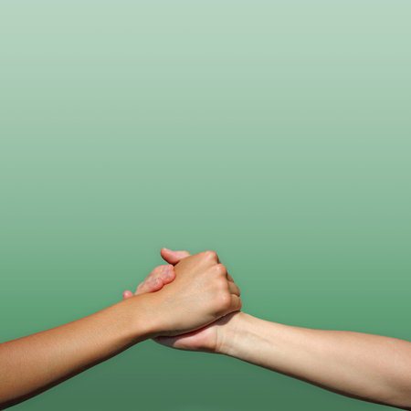 handshake isolated on a green background
