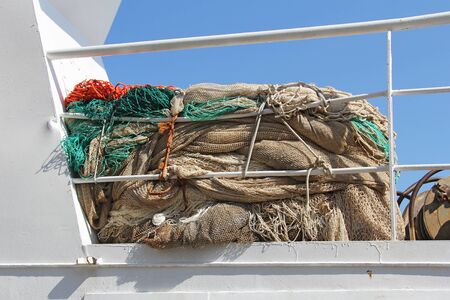 fishing nets on a white boat for fishingの写真素材
