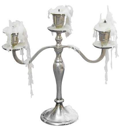 Old Candlestick with three candles isolated on white backgroundの写真素材