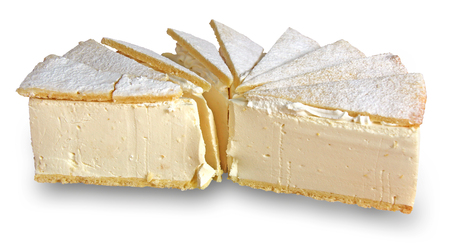 Delicious cream pie cut into slices isolated on white backgroundの写真素材