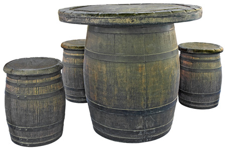 Old wooden barrels used as tables and chairsの写真素材