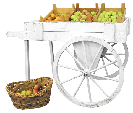 Old wooden cart with apples isolated on white backgroundの写真素材