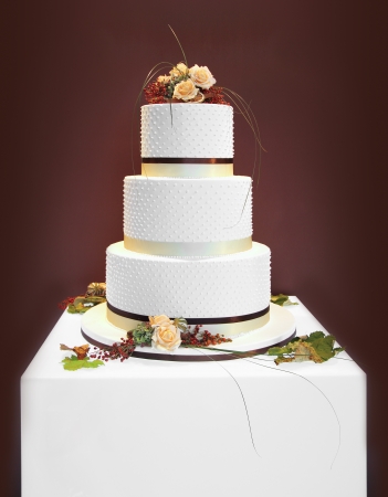 Big white wedding cake decorated with flowersの写真素材