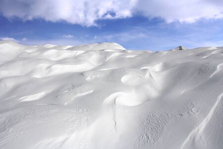 Great snow dunes and clouds in the background in Vogel, Slovenia の写真素材