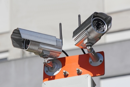 Two security cameras for monitoring building structureの写真素材