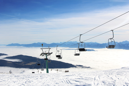 Ski lift and skiers on the Mountain ski resort Gerlitzen, Austriaのeditorial素材