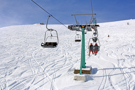 Ski lift and skiers on the Mountain ski resort Gerlitzen, Austriaのeditorial素材