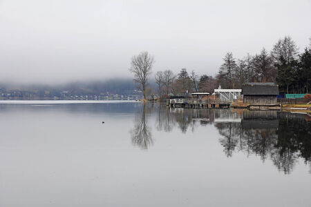 Lake landscape at Ossiacher See, misty winter dayの写真素材