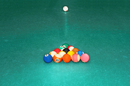 Billiards balls in triangle on the green cloth tableの写真素材
