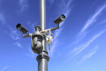 Security camera on blue sky の写真素材