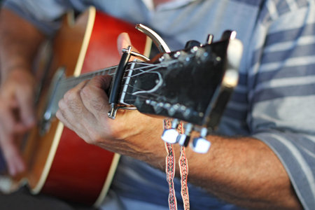 Man playing Acoustic guitar, closeup image