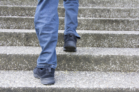 Man climbs on a concrete stairsの写真素材