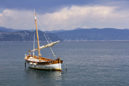 Old wooden sail ship, docked in the port of Portofino, Italy の写真素材