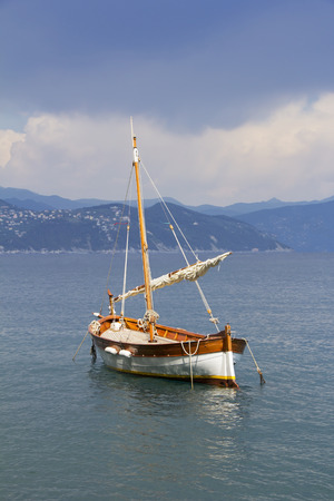 Old wooden sail ship, docked in the port of Portofino, Italy の写真素材