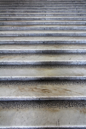 Old damaged stone staircase, up and down, textured backgroundの写真素材