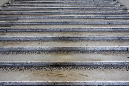 Old damaged stone staircase, up and down, textured backgroundの写真素材