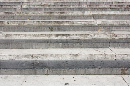 Old damaged stone staircase, up and down, textured backgroundの写真素材