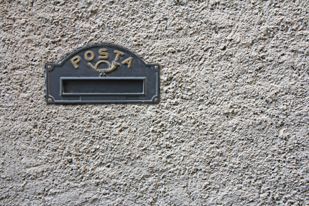 Vintage Black Iron Mailbox built into the facade of the houseの写真素材