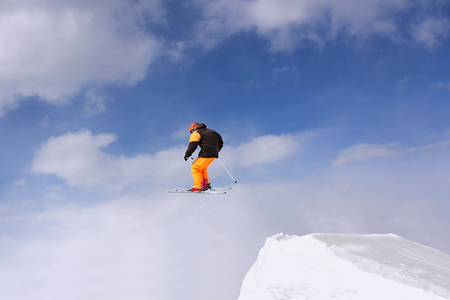 Extreme Jumping skier at in high jumpの写真素材
